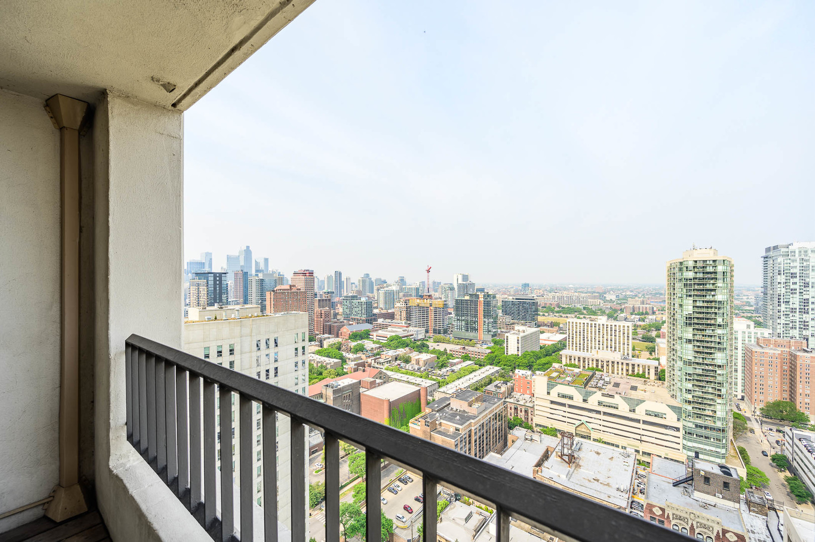 1030 North State Street, Unit 29M Chicago, IL 60610 - Photo 9 of 11 a view of a city from a balcony