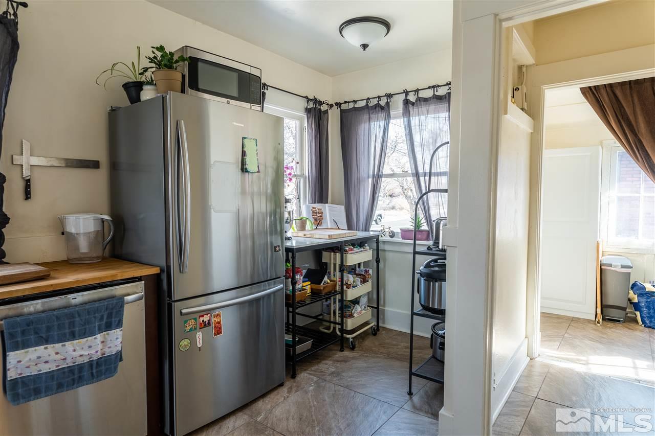 800 South Center Street Reno, NV 89501 - Photo 11 of 23 a kitchen with stainless steel appliances a refrigerator and a stove top oven