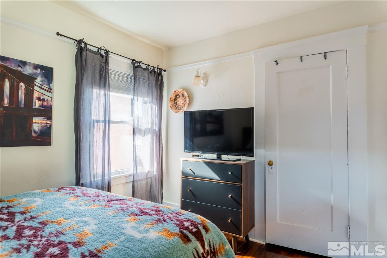 800 South Center Street Reno, NV 89501 - Photo 15 of 23 a bedroom with a bed and a flat screen tv