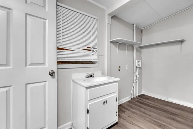 a bathroom with a sink a mirror and a shower