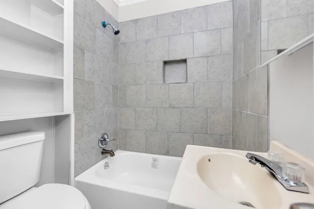 a bathroom with a sink and toilet