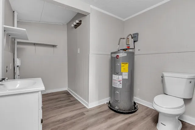 a bathroom with a toilet and a sink