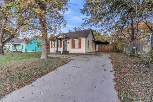 a house with a tree in front of it