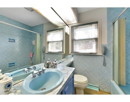 162 Mallowhill Road Springfield, MA 01129 - Photo 13 of 34 a bathroom with a sink toilet a mirror and next to a window