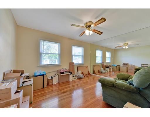 162 Mallowhill Road Springfield, MA 01129 - Photo 14 of 34 a living room with furniture a dining table and a window