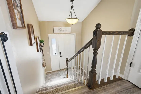 a view of entryway with wooden floor