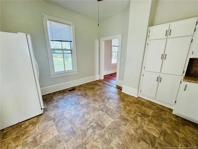 a view of an empty room with windows