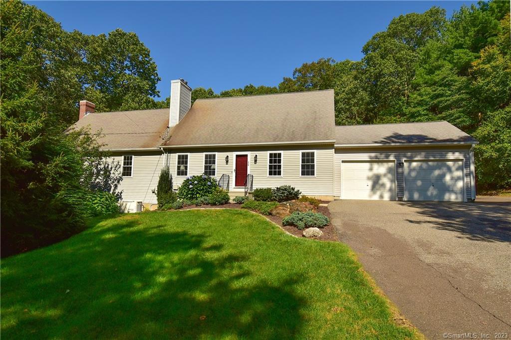 318 Old Post Road Tolland, CT 06084 - Photo 1 of 1 a view of a yard in front of a house with plants and large tree