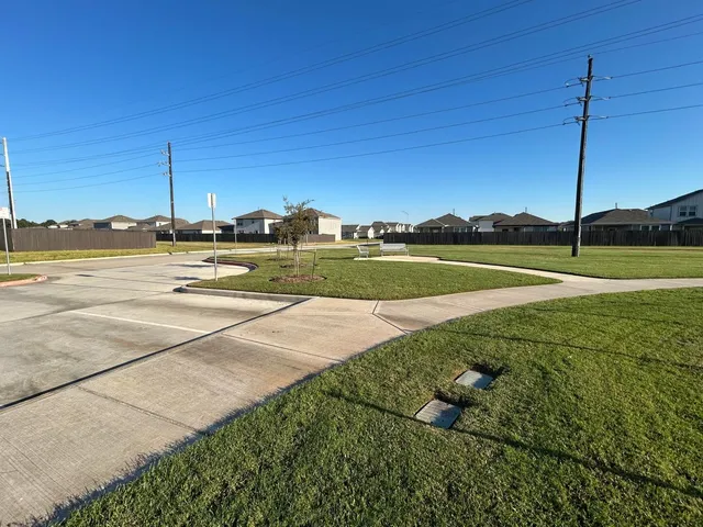 a view of a golf course with a lake view