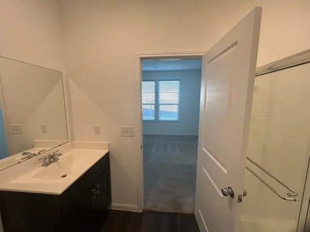 a bathroom with a sink and mirror