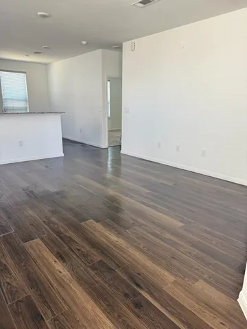 a view of a livingroom with wooden floor