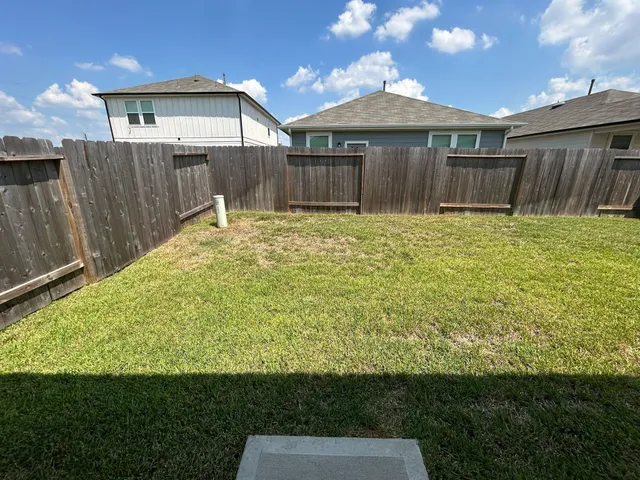 a view of balcony with two chairs and a stove