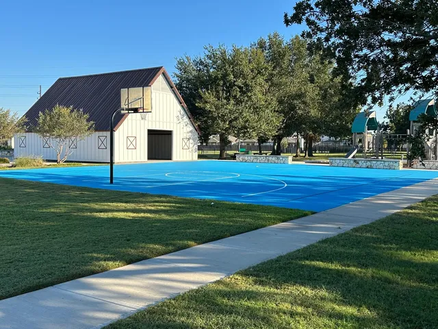a view of a park with swings and slides