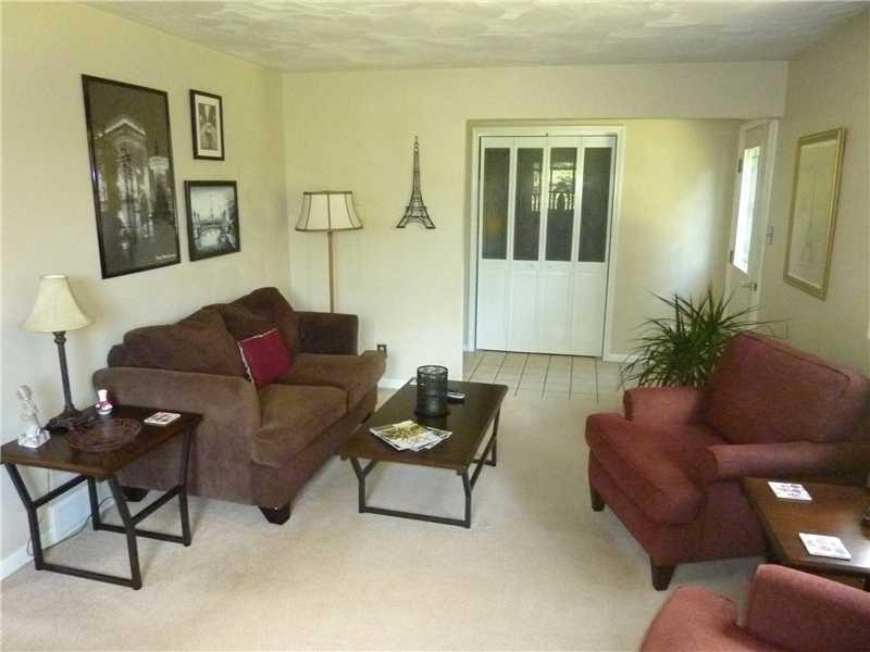 412 Denny Road Valencia, PA 16059 - Photo 3 of 25 Living Room. This a a view of the comforting living room that opens to the foyer and dining room. This view shows the spacious closet in the foyer.