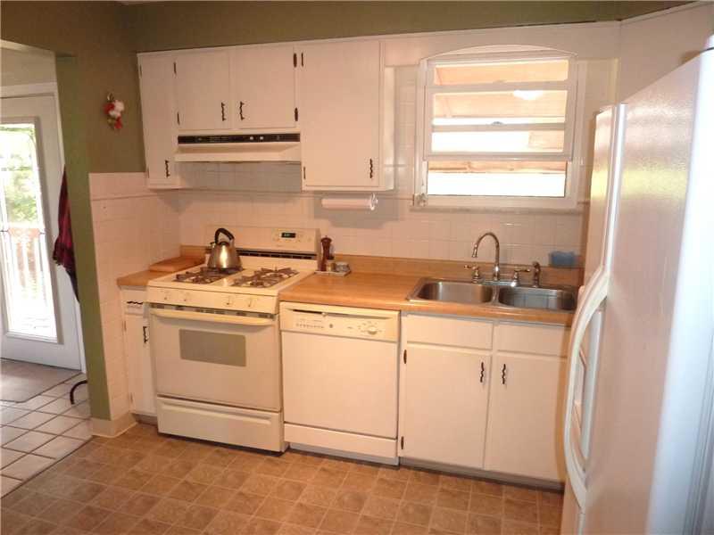 412 Denny Road Valencia, PA 16059 - Photo 7 of 25 Kitchen. The convenient layout of the kitchen is open to both sides. The newer tile flooring looks like stone!