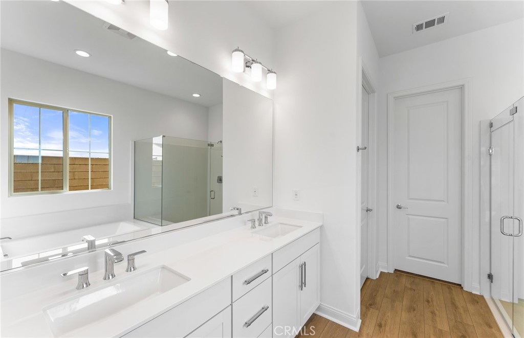 743 Corkscrew Road Rancho Mission Viejo, CA 92694 - Photo 17 of 35 a bathroom with a sink double vanity and a mirror