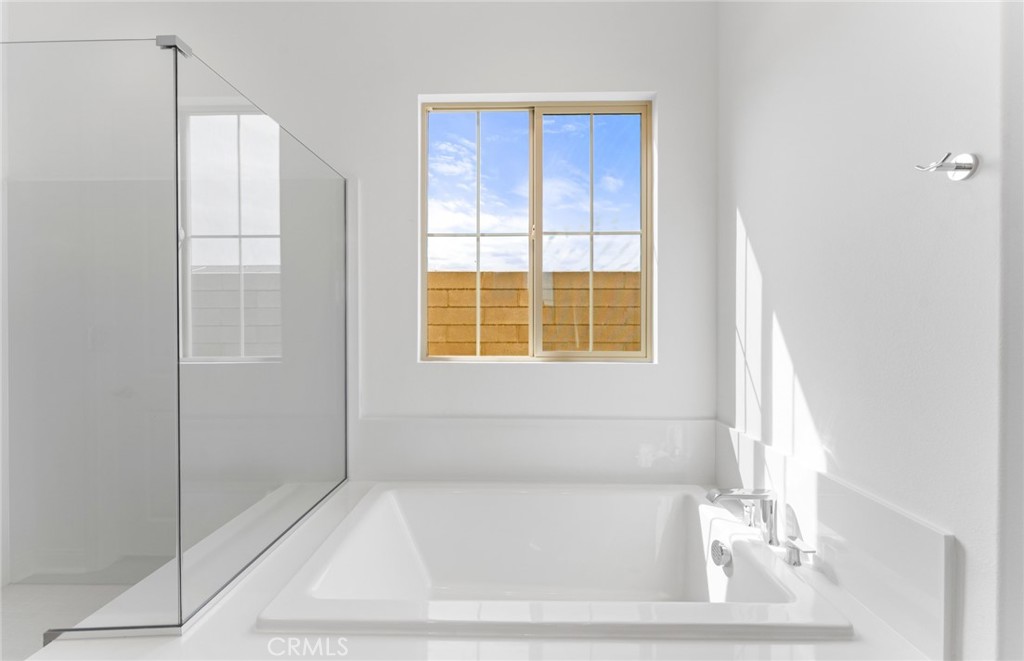 743 Corkscrew Road Rancho Mission Viejo, CA 92694 - Photo 18 of 35 a white bath tub sitting next to a window
