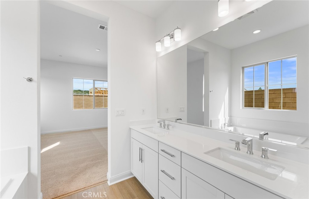 743 Corkscrew Road Rancho Mission Viejo, CA 92694 - Photo 20 of 35 a bathroom with a sink double vanity and a mirror
