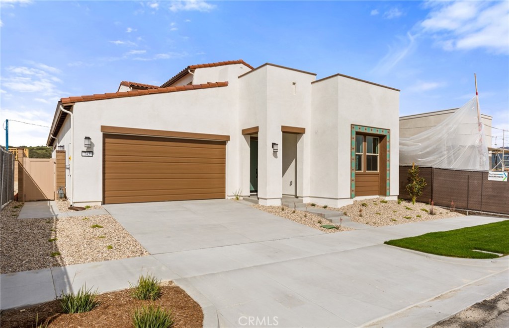 743 Corkscrew Road Rancho Mission Viejo, CA 92694 - Photo 2 of 35 a front view of a house with a yard