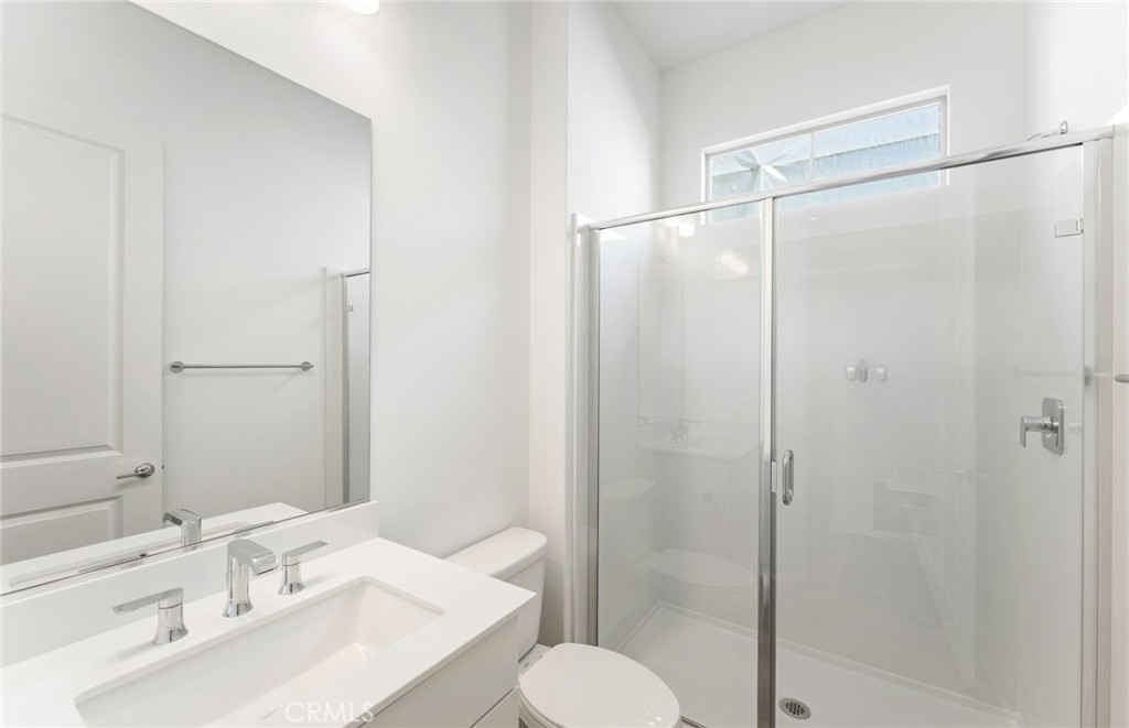 743 Corkscrew Road Rancho Mission Viejo, CA 92694 - Photo 24 of 35 a bathroom with a sink toilet and shower