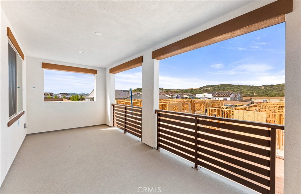 743 Corkscrew Road Rancho Mission Viejo, CA 92694 - Photo 28 of 35 a view of a room with furniture and floor to ceiling windows