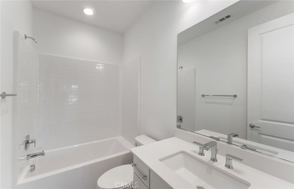 743 Corkscrew Road Rancho Mission Viejo, CA 92694 - Photo 30 of 35 a bathroom with a sink toilet and bathtub