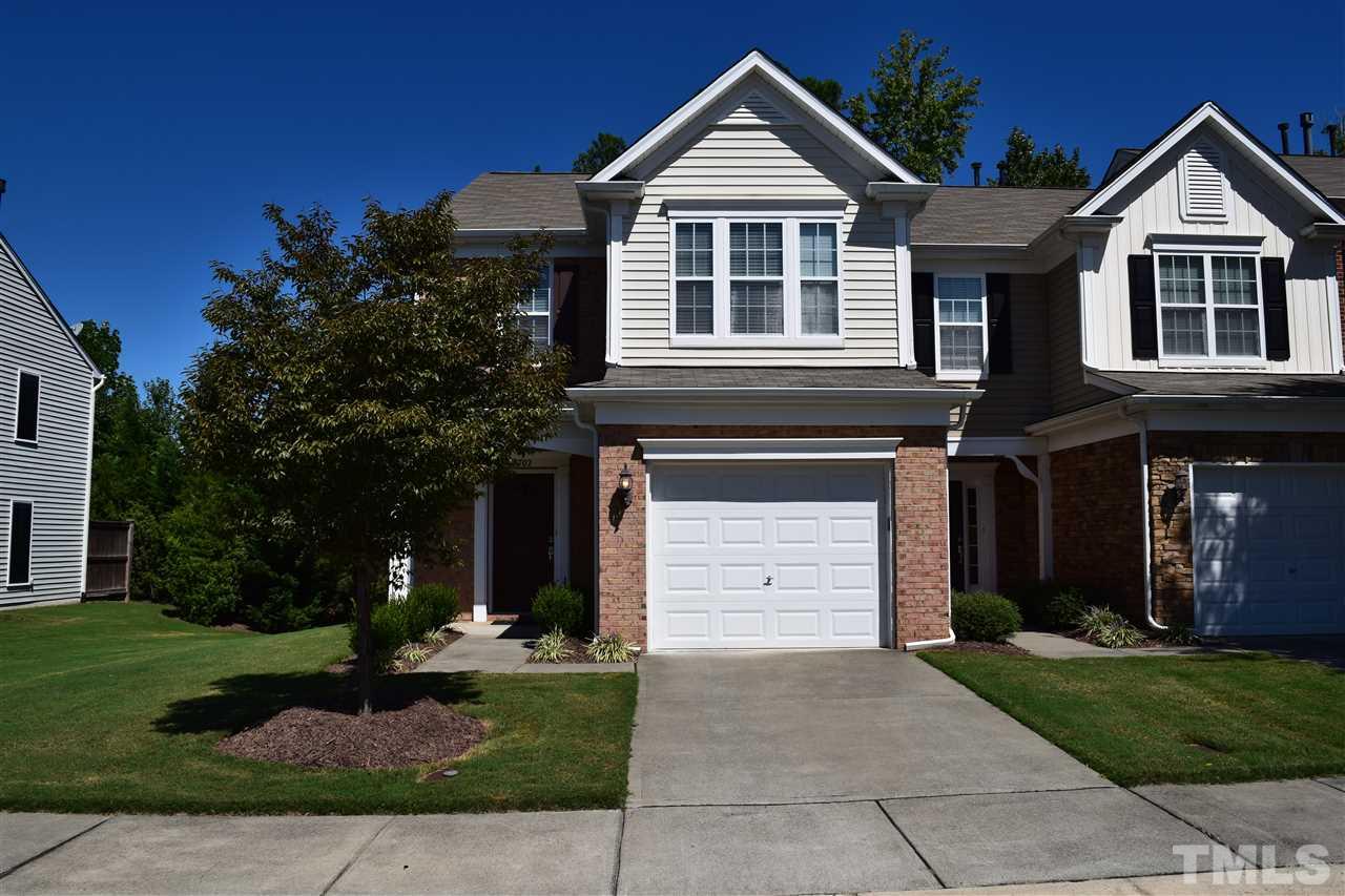 8702 Redcrest Place Raleigh, NC 27617 - Photo 1 of 22 a front view of a house with a yard