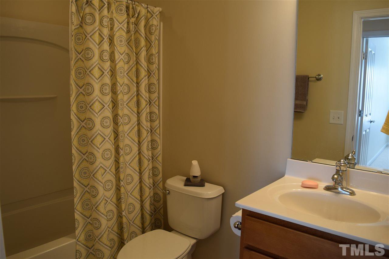 8702 Redcrest Place Raleigh, NC 27617 - Photo 10 of 22 a bathroom with a sink a toilet and shower