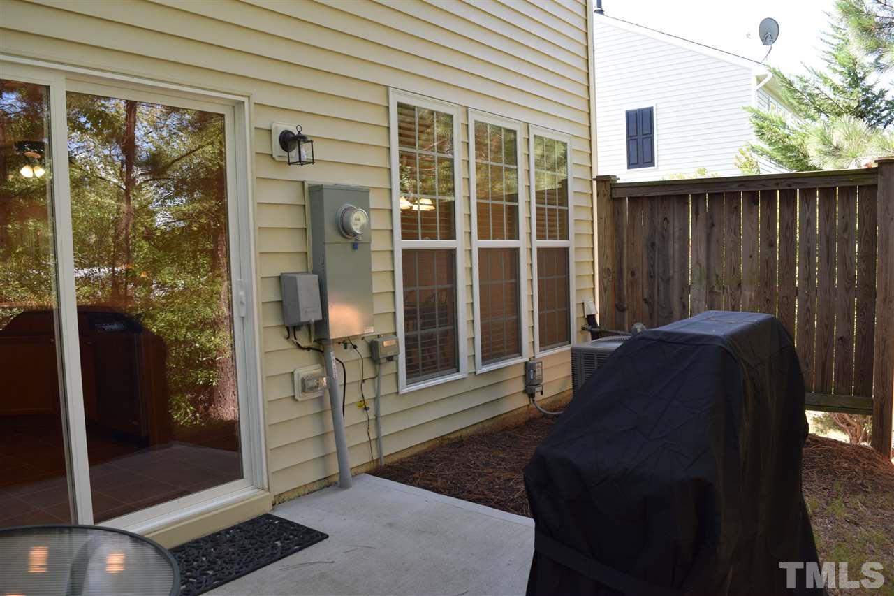 8702 Redcrest Place Raleigh, NC 27617 - Photo 16 of 22 a front view of a house with a floor to ceiling window