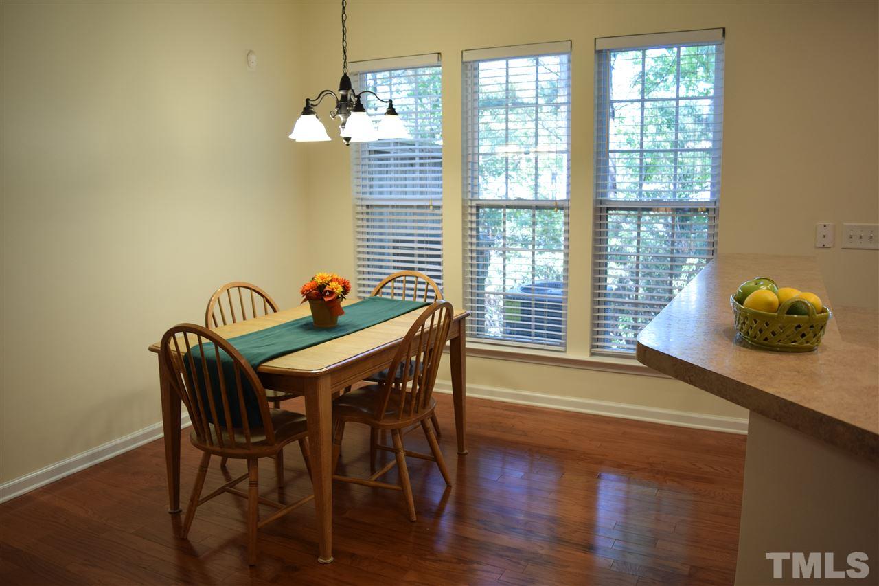 8702 Redcrest Place Raleigh, NC 27617 - Photo 3 of 22 a dining room with furniture and window