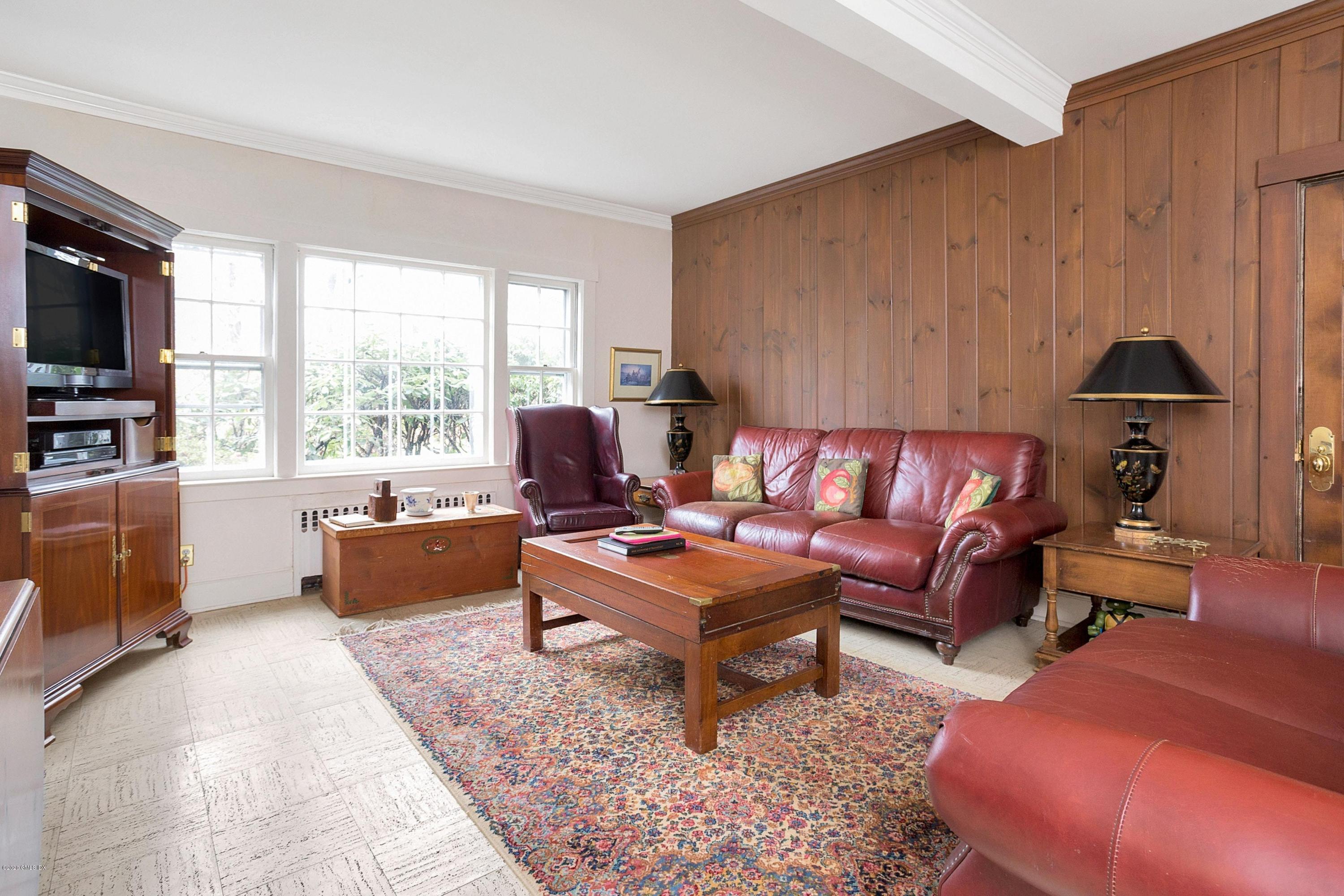 207 Round Hill Road Greenwich, CT 06831 - Photo 12 of 28 a living room with furniture and a flat screen tv