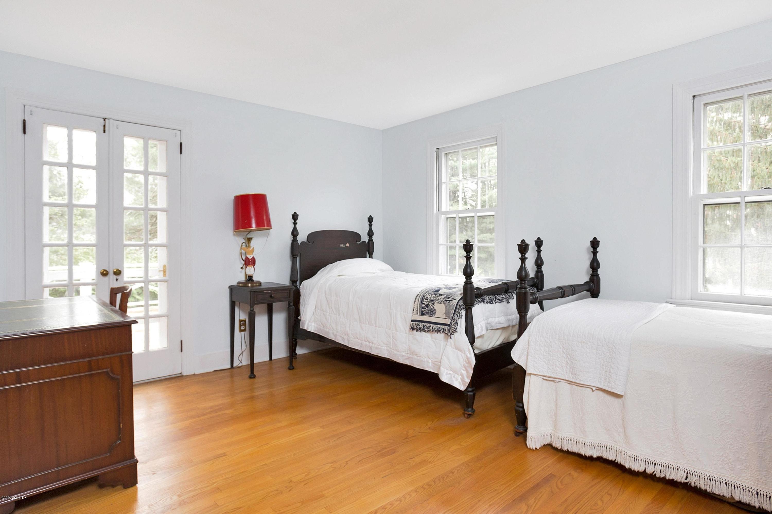 207 Round Hill Road Greenwich, CT 06831 - Photo 17 of 28 a bedroom with bed and window
