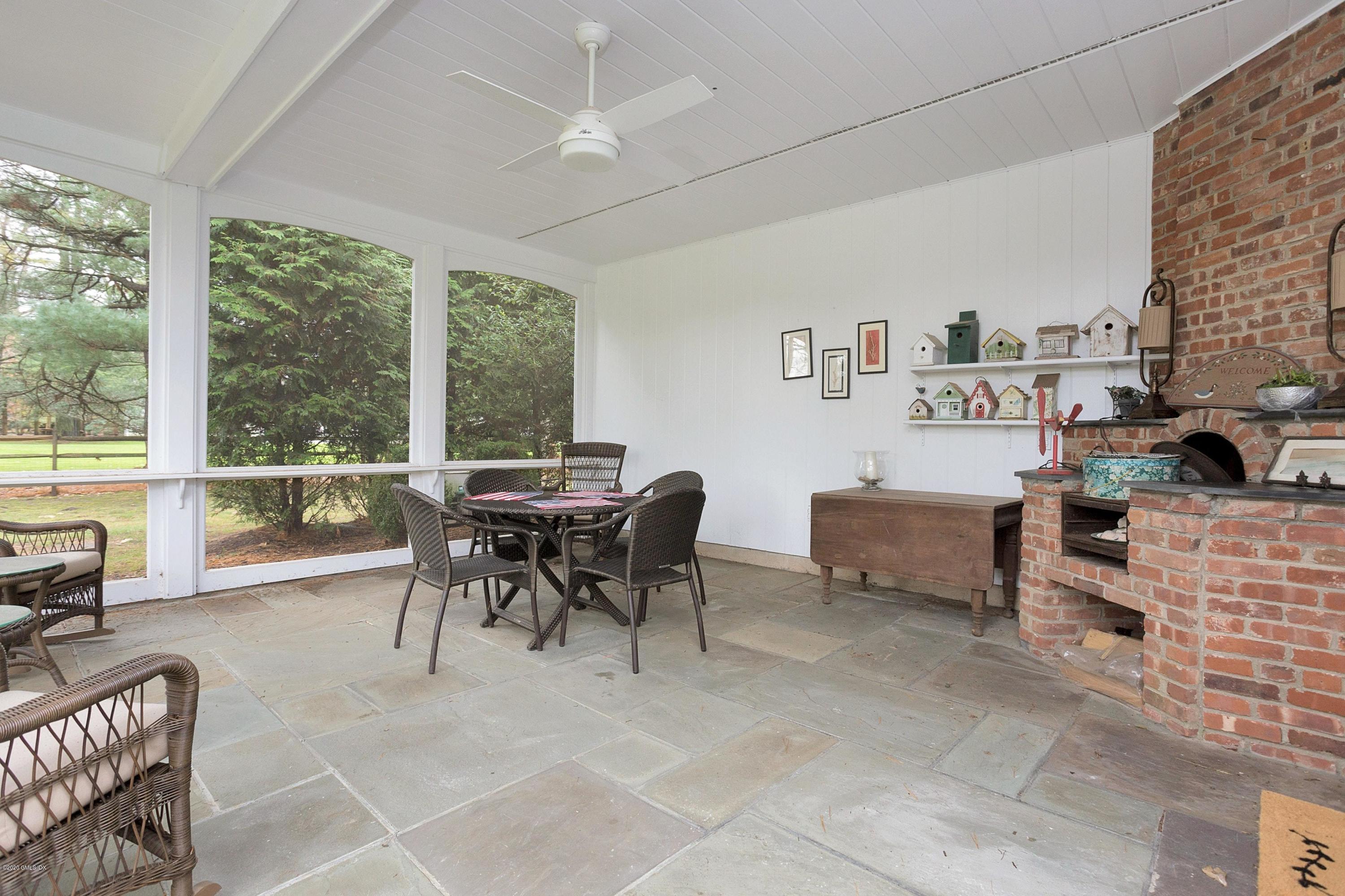 207 Round Hill Road Greenwich, CT 06831 - Photo 21 of 28 a view of a dining room with furniture window and outside view