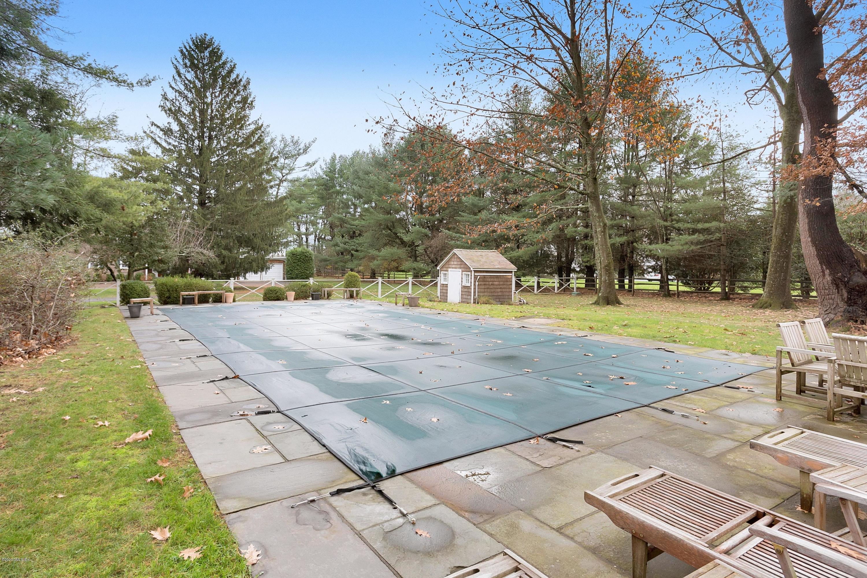 207 Round Hill Road Greenwich, CT 06831 - Photo 23 of 28 a view of yard with swimming pool and sitting area