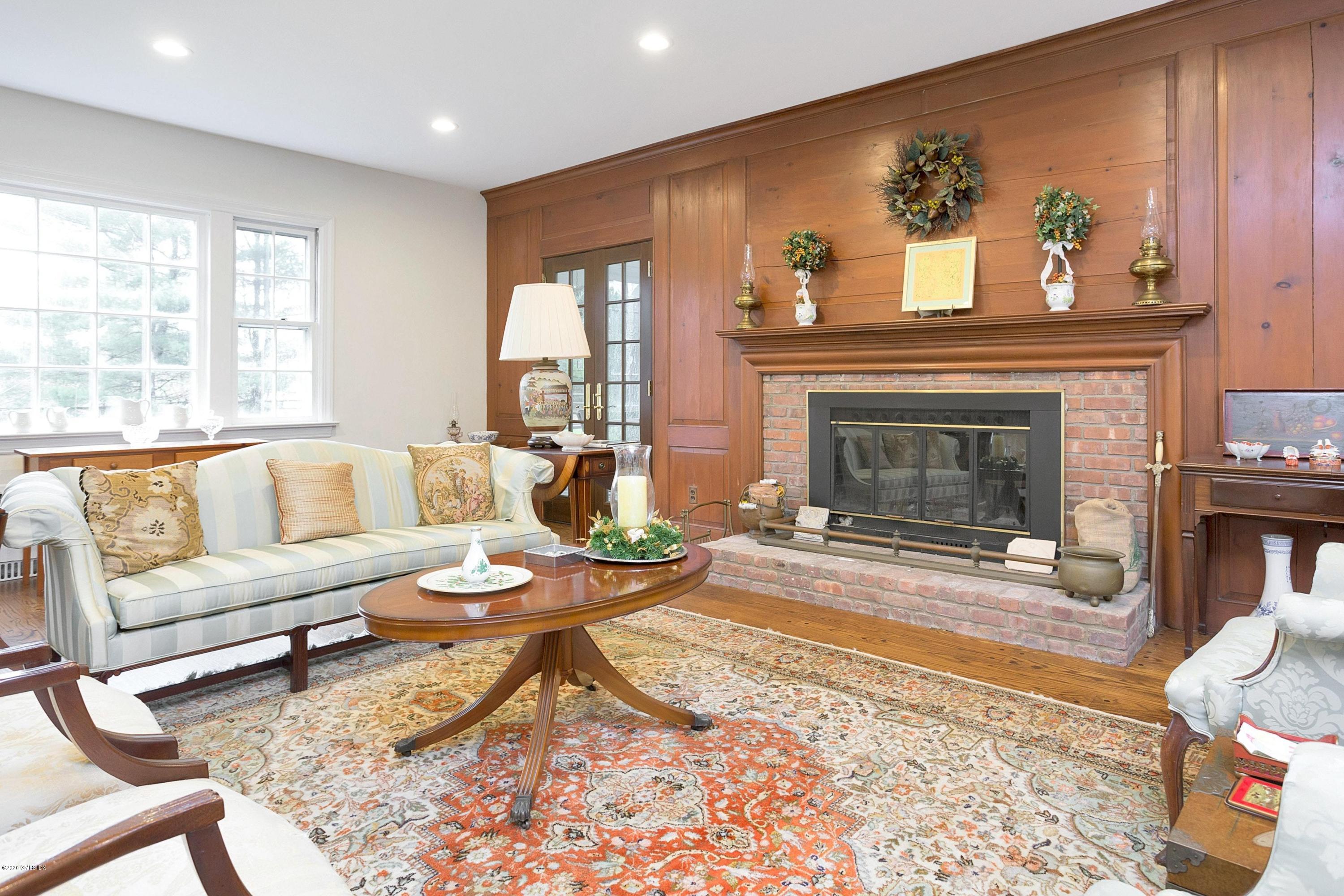 207 Round Hill Road Greenwich, CT 06831 - Photo 7 of 28 a living room with furniture and a fireplace