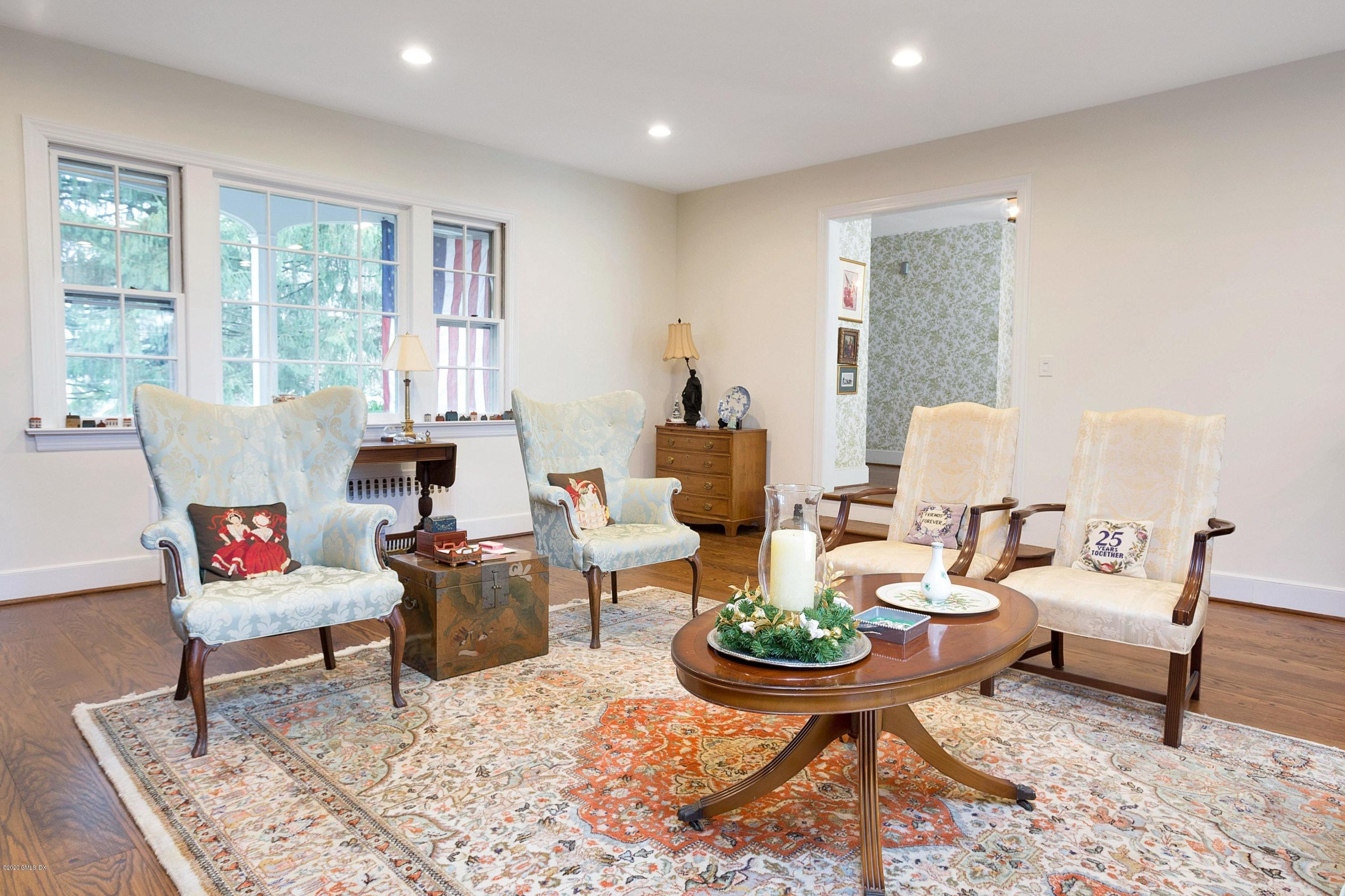 207 Round Hill Road Greenwich, CT 06831 - Photo 8 of 28 a living room with furniture and a large window