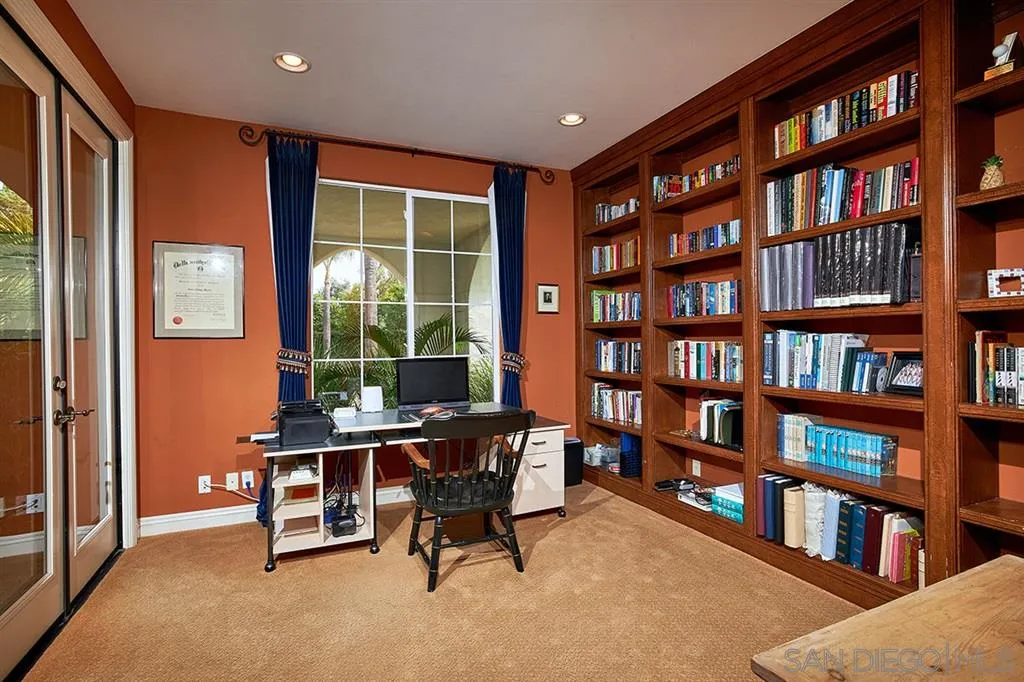 13625 Ash Hollow Crossing Road Poway, CA 92064 - Photo 14 of 25 a view of a livingroom with furniture and a bookshelf