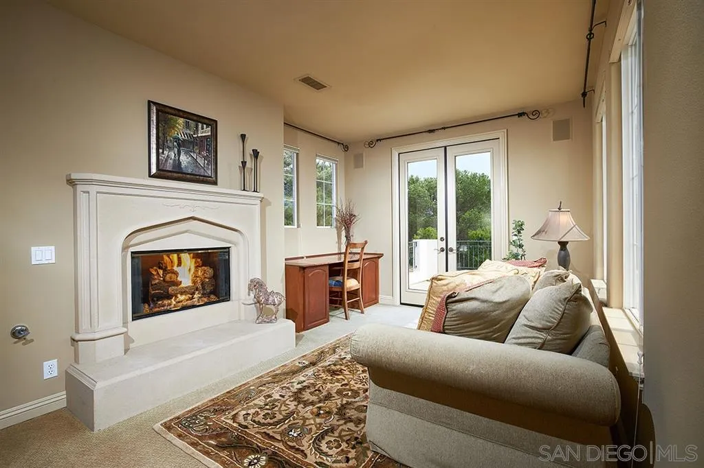 13625 Ash Hollow Crossing Road Poway, CA 92064 - Photo 15 of 25 a living room with furniture and a fireplace