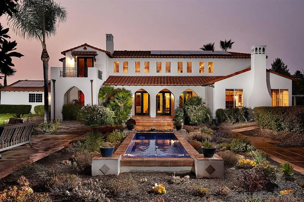 13625 Ash Hollow Crossing Road Poway, CA 92064 - Photo 2 of 25 a front view of a house with garden and porch