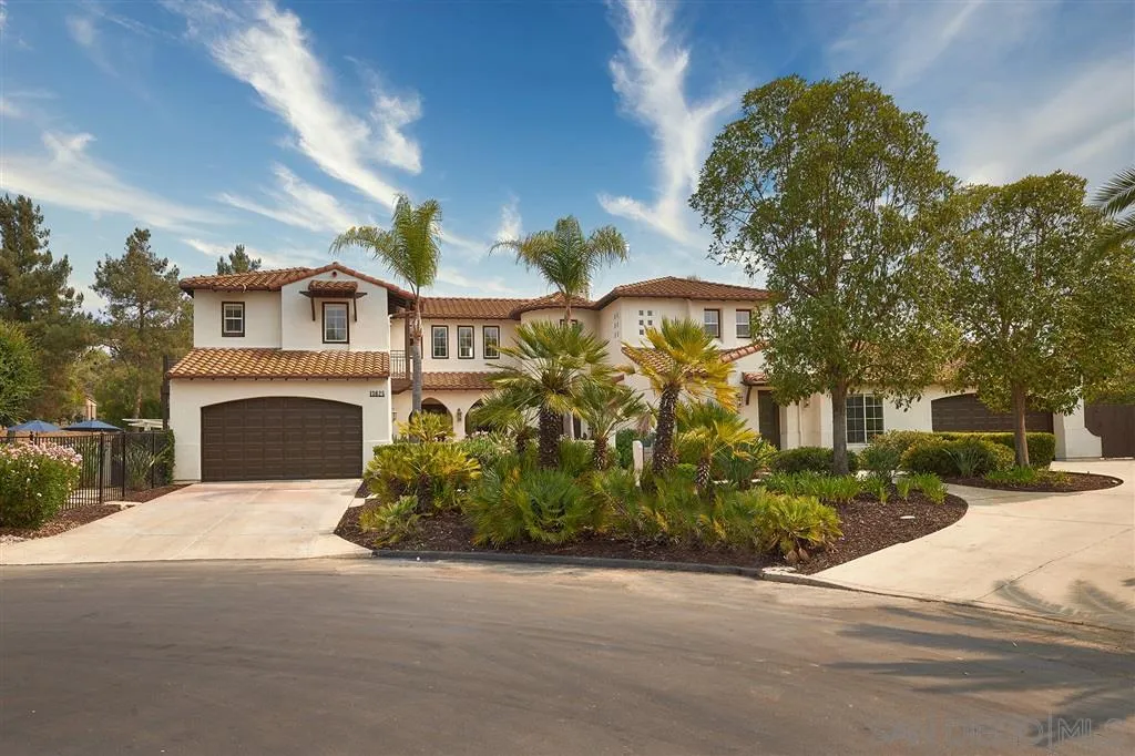 13625 Ash Hollow Crossing Road Poway, CA 92064 - Photo 23 of 25 a front view of a house with yard and trees