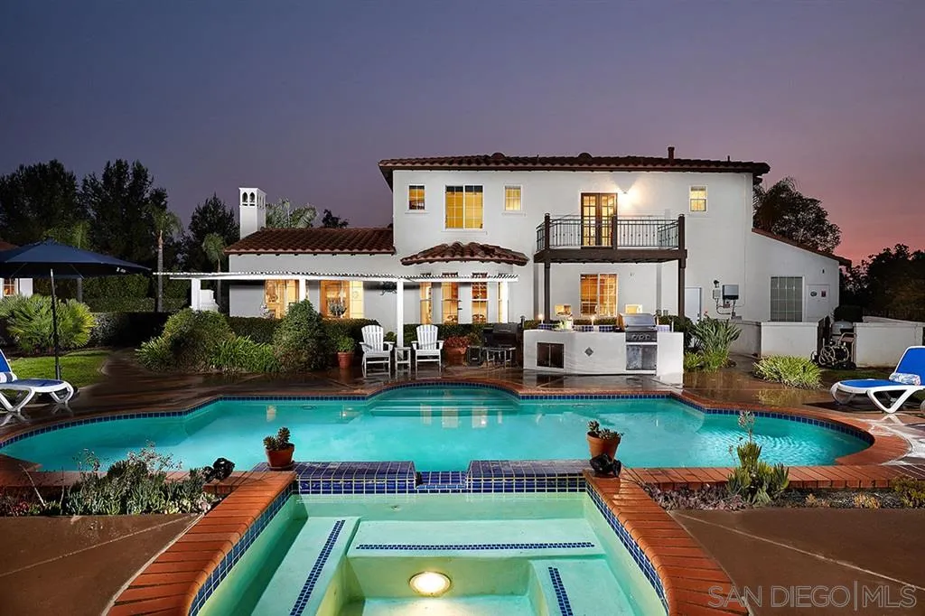 13625 Ash Hollow Crossing Road Poway, CA 92064 - Photo 3 of 25 a view of a house with swimming pool and a yard