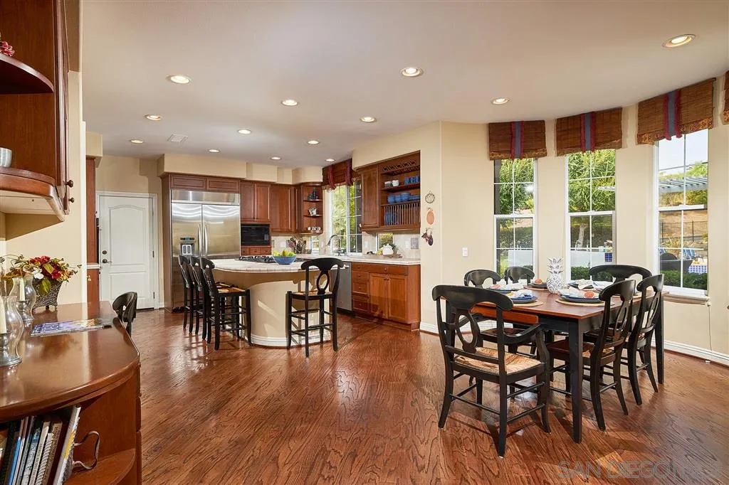 13625 Ash Hollow Crossing Road Poway, CA 92064 - Photo 10 of 25 a view of a dining room with furniture window and wooden floor