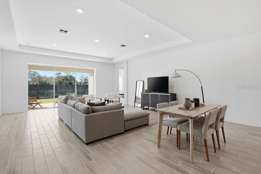 14242 Sawmill Street Parrish, FL 34219 - Photo 12 of 41 a living room with furniture and a flat screen tv