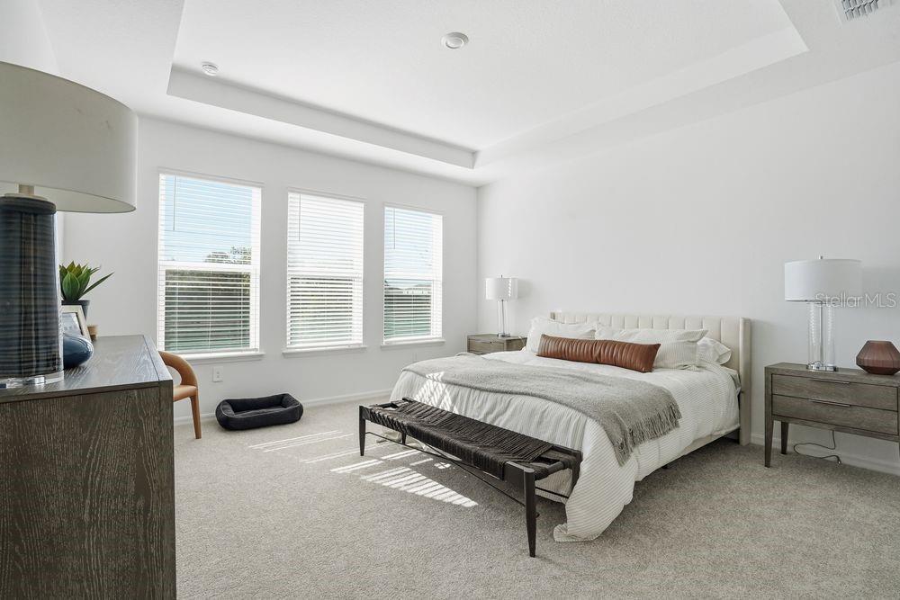 14242 Sawmill Street Parrish, FL 34219 - Photo 14 of 41 a bedroom with a bed and with furniture