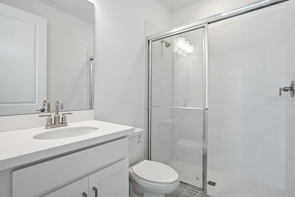 14242 Sawmill Street Parrish, FL 34219 - Photo 23 of 41 a bathroom with a sink toilet and shower