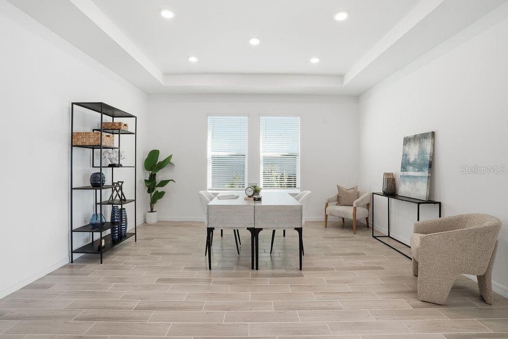 14242 Sawmill Street Parrish, FL 34219 - Photo 27 of 41 a dining room with furniture and wooden floor