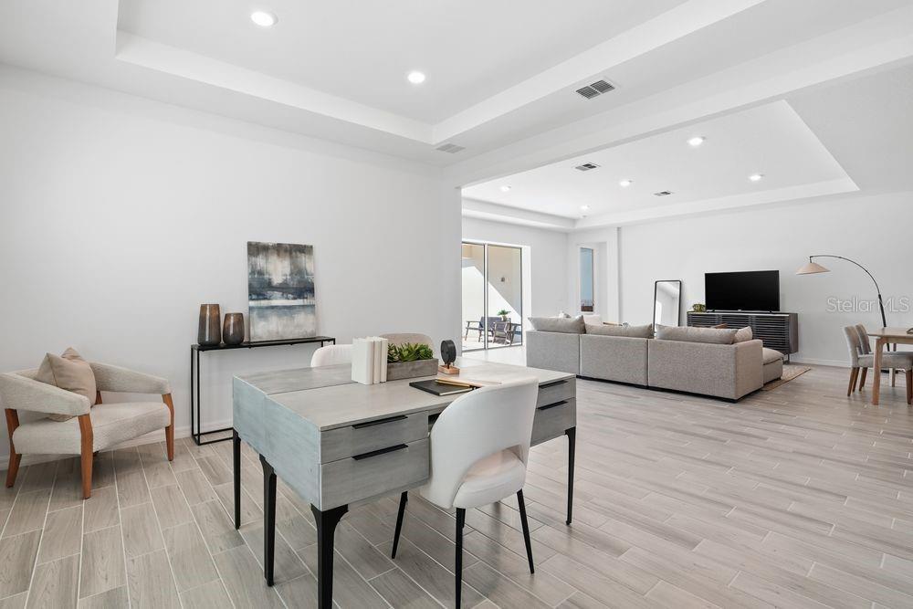 14242 Sawmill Street Parrish, FL 34219 - Photo 28 of 41 a living room with furniture and a wooden floor