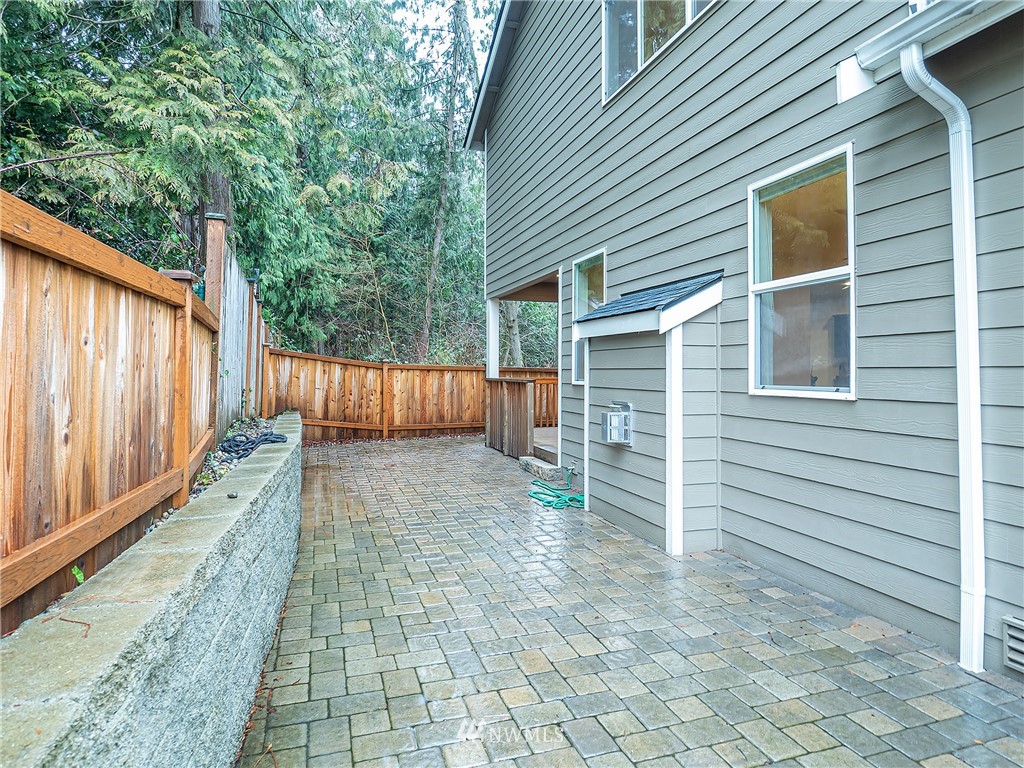 415 161st Place Southeast Bothell, WA 98012 - Photo 22 of 28 a view of a house with backyard and wooden fence