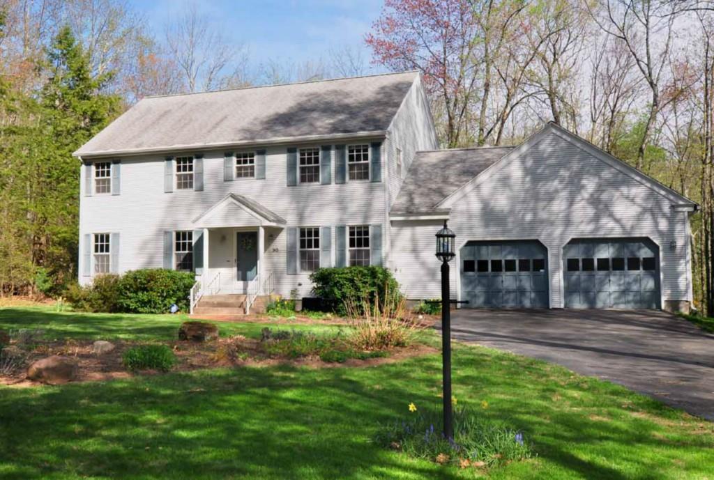 30 Petersen Road Granby, CT 06035 - Photo 1 of 1 a front view of a house with yard and green space