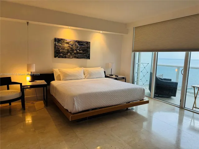 a bedroom with two beds and a night stand